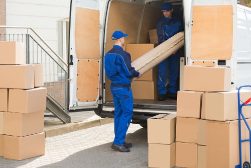 House removalists in Andstorage loading moving boxes into a truck
