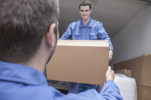 Removal team loading household belongings into a vehicle