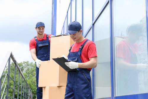 Professional house removals team handling fragile items in Andstorage