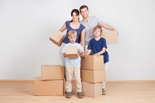Movers using protective equipment during a safe home removal