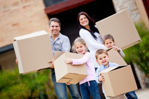 Moving team packing and organizing belongings for relocation
