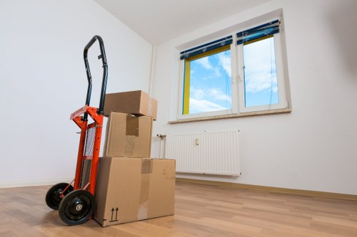 Team preparing office furniture for removal in Andstorage