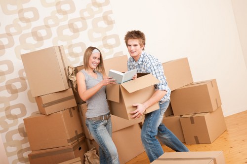 Moving day preparation with labeled boxes and protective wrapping